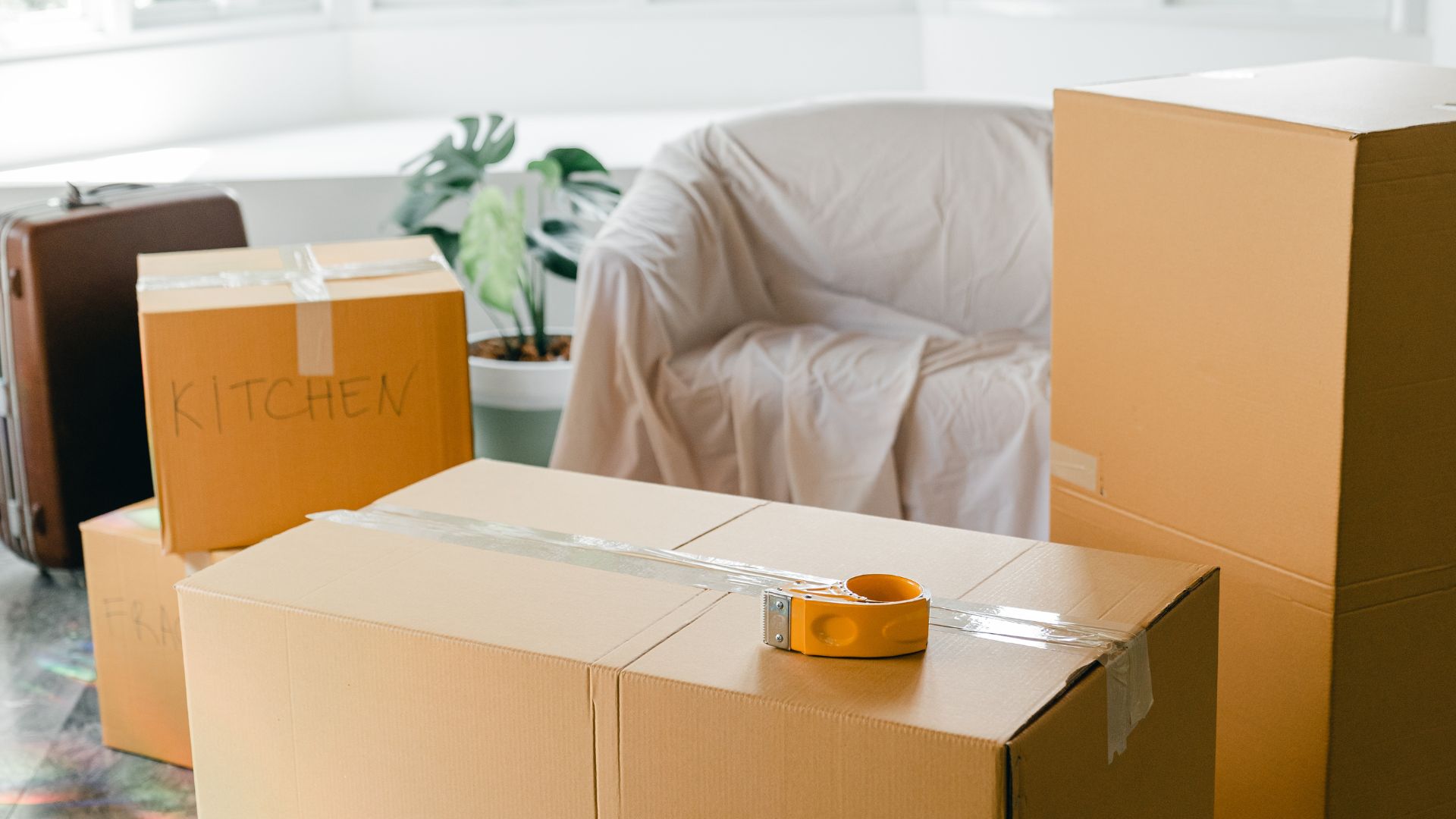 A room filled with boxes and a chair