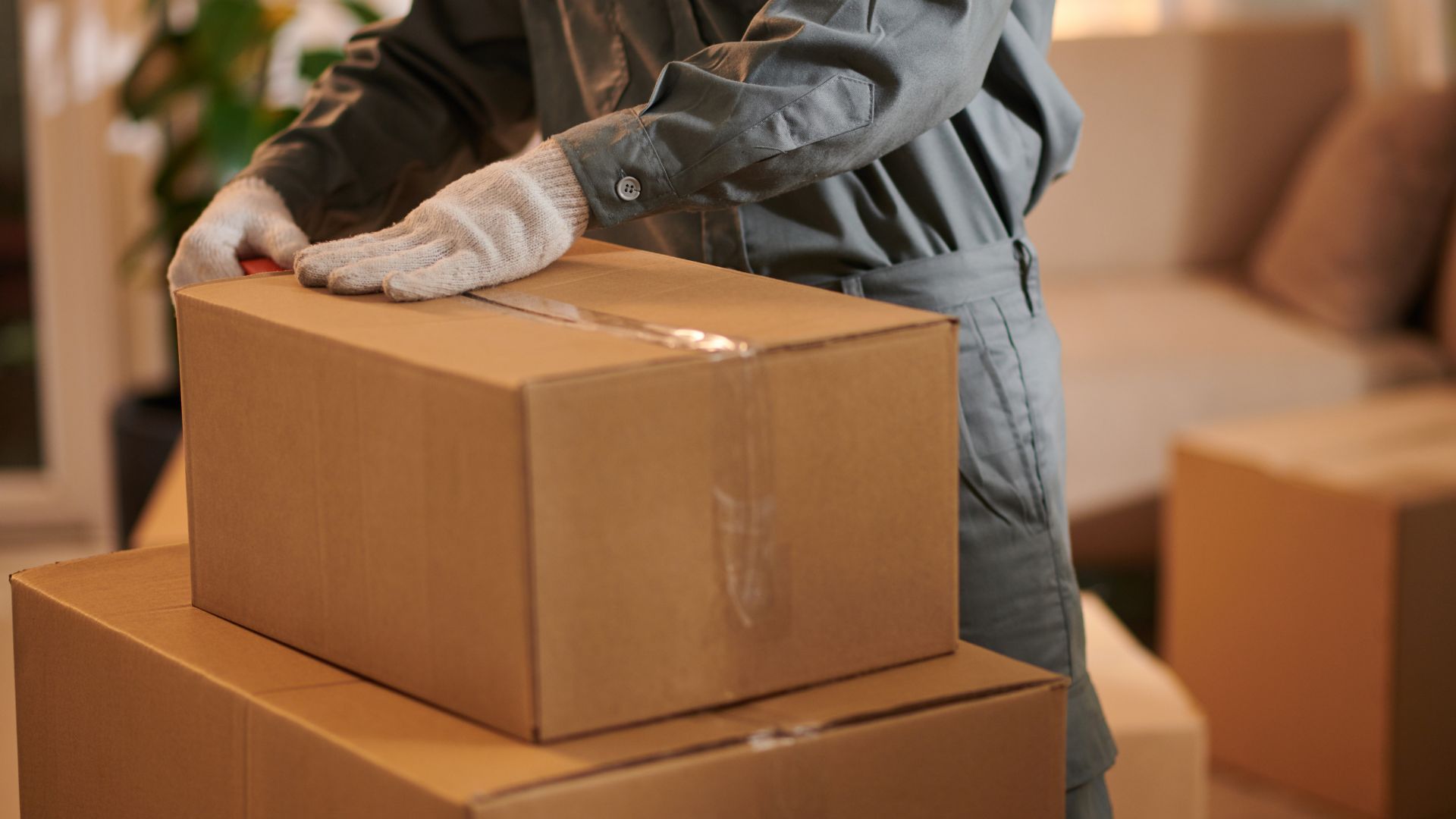 A person in a room with boxes and gloves